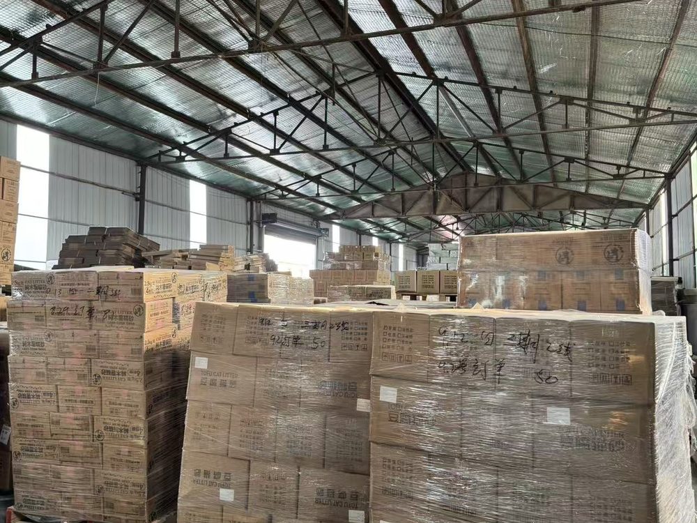 PEA PET warehouse stocked with packed plant-based cat litter ready for export